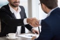 Close up of businessmen handshaking after successful meeting Royalty Free Stock Photo