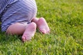 Close up. Happy Child Feet Barefoot on Green Grass. Healthy Lifestyle. Spring Time. Rear view. the concept of flatfoot Royalty Free Stock Photo