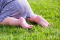 Close up. Happy Child Feet Barefoot on Green Grass. Healthy Lifestyle. Spring Time. Rear view. the concept of flatfoot Royalty Free Stock Photo