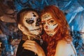 Close up of happy couple in Halloween Costume and Makeup. Bloody theme: the crazy maniak faces