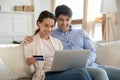 Close up happy couple paying by credit card online together Royalty Free Stock Photo