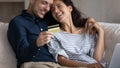 Close up happy couple paying online by credit card Royalty Free Stock Photo