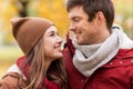 Close up of happy couple walking in autumn park Royalty Free Stock Photo