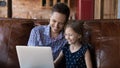 Close up happy father and little daughter using laptop together Royalty Free Stock Photo