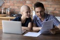 Close up happy hairless wife and husband reading good news Royalty Free Stock Photo