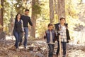 Close up of happy Hispanic family hiking in forest, close up Royalty Free Stock Photo