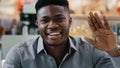 Close-up happy joyful african american man looking at camera talking on video call smiling recording video blog cheerful Royalty Free Stock Photo