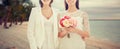 Close up of happy lesbian couple with flowers Royalty Free Stock Photo