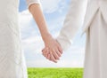 Close up of happy lesbian couple holding hands Royalty Free Stock Photo