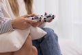 Close up.Happy LGBT lesbian couple holding joysticks and playing video game in relax day