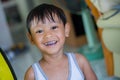 Close up of happy little boy make big eye with metal crowns Royalty Free Stock Photo