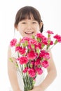 Close up of happy little girl holding a bouquet of carnations