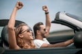 Close up.happy loving couple traveling in a car. Royalty Free Stock Photo