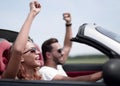 Close up.happy loving couple traveling in a car. Royalty Free Stock Photo