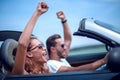 Close up.happy loving couple traveling in a car. Royalty Free Stock Photo