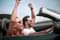 close up.happy loving couple traveling in a car. Royalty Free Stock Photo