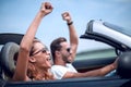 Close up.happy loving couple traveling in a car. Royalty Free Stock Photo