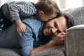 Close up happy loving father and adorable little son cuddling Royalty Free Stock Photo