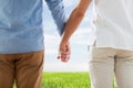 Close up of happy male gay couple holding hands Royalty Free Stock Photo