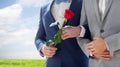 Close up of happy male gay couple holding hands Royalty Free Stock Photo