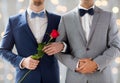 Close up of happy male gay couple holding hands Royalty Free Stock Photo