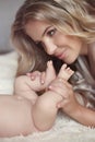 Close-up of happy Mother hugging Baby's feet her Newborn baby gi Royalty Free Stock Photo