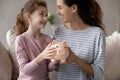 Close up happy mother with little daughter holding piggy bank Royalty Free Stock Photo