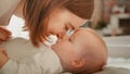 Close Up of a Happy Mother Playing with a Cute Newborn Baby. Mom Bonding with a Toddler, Rubbing Royalty Free Stock Photo