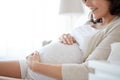 Close up of happy pregnant woman in bed at home Royalty Free Stock Photo