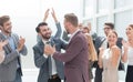 Happy project Manager accepting congratulations of his colleagues Royalty Free Stock Photo