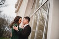 Close up of happy romantic attractive young couple kissing and hugging at the street Royalty Free Stock Photo