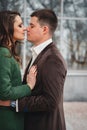 Close up of happy romantic attractive young couple kissing and hugging at the street Royalty Free Stock Photo