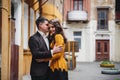 Close up of happy romantic attractive young couple smiling and hugging at the small street, old city Royalty Free Stock Photo