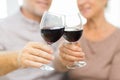 Close up of happy senior couple with red wine Royalty Free Stock Photo