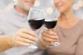 Close up of happy senior couple with red wine Royalty Free Stock Photo