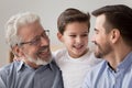Close up of happy three generations of men have fun Royalty Free Stock Photo