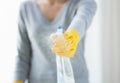 Close up of happy woman with cleanser spraying Royalty Free Stock Photo