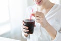 Close up of happy woman drinking coca cola Royalty Free Stock Photo