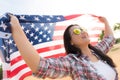 Close up happy woman holding United States of America flag Royalty Free Stock Photo
