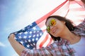 Close up happy woman holding United States of America flag Royalty Free Stock Photo