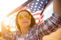 Close up happy woman holding United States of America flag and r Royalty Free Stock Photo