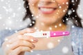 Close up of happy woman with home pregnancy test Royalty Free Stock Photo