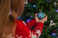 Close up of Happy Woman Decorating Christmas Tree, Concept of New Year Holidays Royalty Free Stock Photo