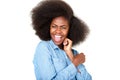 Close up happy young african american woman laughing against isolated white background Royalty Free Stock Photo