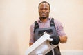 Close-up Of Happy Young African Male Plumber Repairing Sink In Bathroom Royalty Free Stock Photo