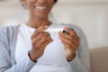 Close up happy young african woman holding plastic test. Royalty Free Stock Photo