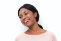 Close up happy young black woman laughing and looking the side against white background Royalty Free Stock Photo