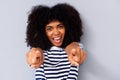 Close up happy young black woman smiling and pointing fingers Royalty Free Stock Photo