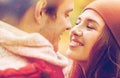 Close up of happy young couple kissing outdoors Royalty Free Stock Photo