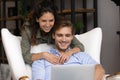 Close up happy young family using laptop together, shopping online Royalty Free Stock Photo